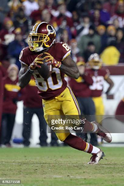 Wide receiver Jamison Crowder of the Washington Redskins runs with the ball after making a catch against the New York Giants at FedExField on...