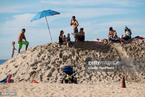 People enjoy Venice Beach in Los Angeles, California on November 23, 2017. This Thanksgiving is the hottest on record in Los Angeles. By noon the...