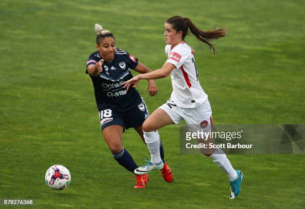 Tiffany Eliadis of the Victory and Rachel Lowe of the Wanderers compete for the ball during the round eight W-League match between the Melbourne...