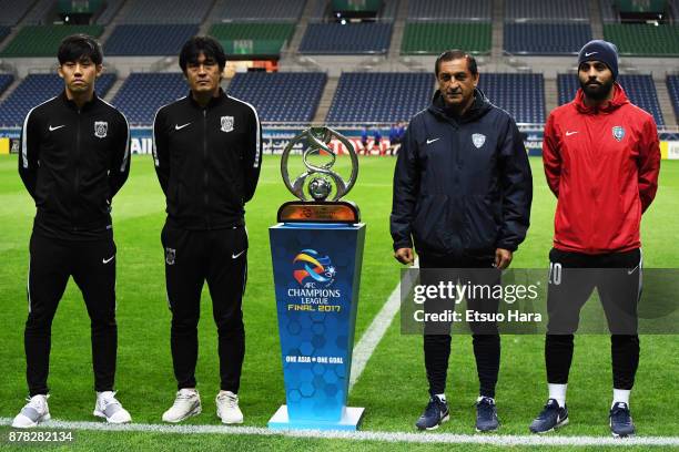 Wataru Endo and head coach Takafumi Hori of Urawa Red Diamonds and head coach Ramon Diaz and Yasser Al Qahtani of Al Hilal pose for phographers in...