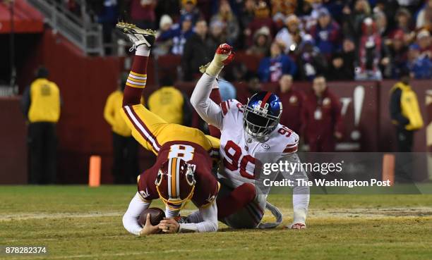 Washington Redskins quarterback Kirk Cousins is sacked any New York Giants defensive end Jason Pierre-Paul in the fourth quarter of the game between...