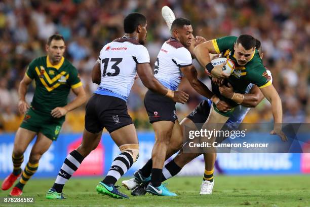 Reagan Campbell-Gillard of the Kangaroos is tackled during the 2017 Rugby League World Cup Semi Final match between the Australian Kangaroos and Fiji...