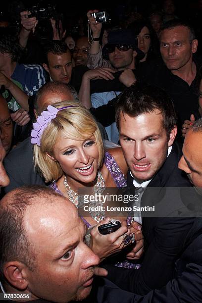 Paris Hilton and Doug Reinhardt leaves the 3.14 Beach Party at the Croisette of Cannes on May 18, 2009 in Cannes, France.