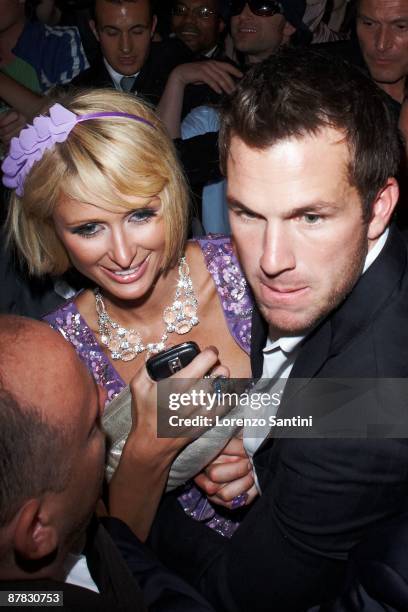 Paris Hilton and Doug Reinhardt leaves the 3.14 Beach Party at the Croisette of Cannes on May 18, 2009 in Cannes, France.