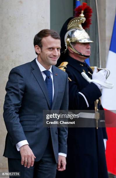 French President Emmanuel Macron smiles after his meeting with Greek Prime Minister Alexis Tsipras at the Elysee Presidential Palace on November 24,...