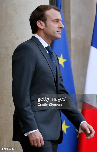 French President Emmanuel Macron waits to welcome Greek Prime Minister Alexis Tsipras prior to their meeting at the Elysee Presidential Palace on...