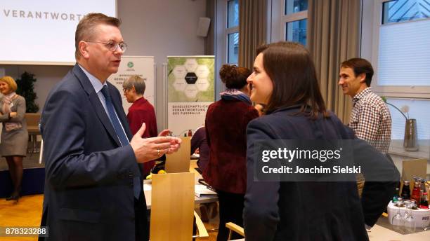 Reinhard Grindel talk to Christine Kumpert during the Annual Conference For Social Responsibility at Sporthotel Fuchsbachtal on November 24, 2017 in...