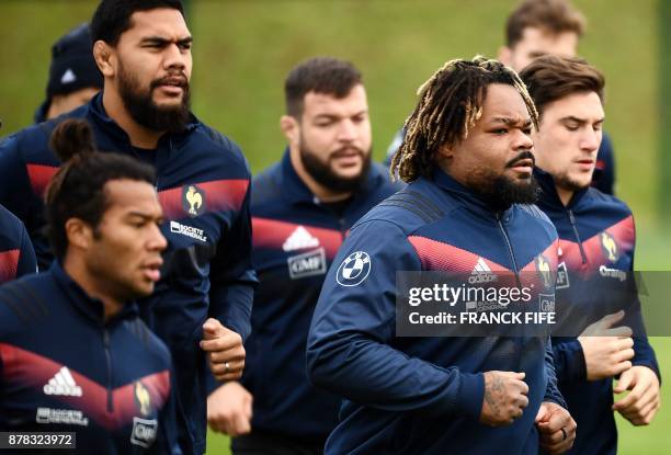 France's national rugby union team centre Mathieu Bastareaud warms up with team mates during a training session on the eve of a friendly rugby union...