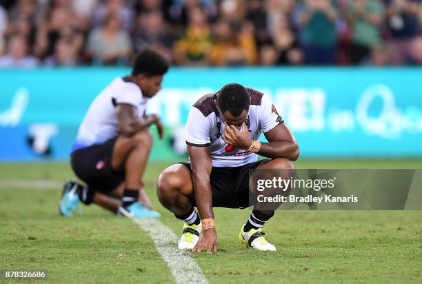 Fijian players look dejected after their team loses the 2017 Rugby League World Cup Semi Final match between the Australian Kangaroos and Fiji at...