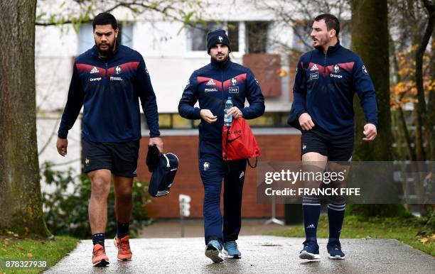 France's national rugby union team lock Romain Taofifenua, full back Hugo Bonneval and N°8 Louis Picamoles arrive for a training session on the eve...
