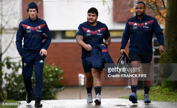 France's national rugby union team scrum half Baptiste Serin, prop Sebastien Taofifenua and prop Jefferson Poirot arrive for a training session on...
