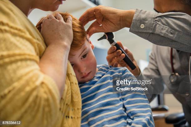 let me see in your ear! - otoscope stock pictures, royalty-free photos & images