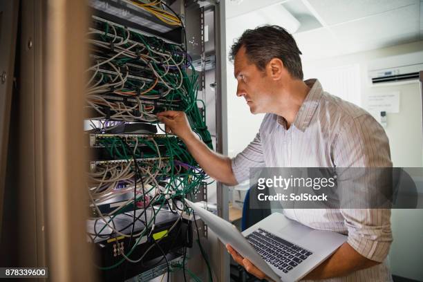 checking the server - telecommunications equipment stock pictures, royalty-free photos & images