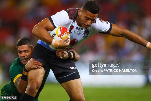 Dane Gagai of Australia tackles Taane Milne of Fiji during the Rugby League World Cup men's semi-final match between Australia and Fiji at the...