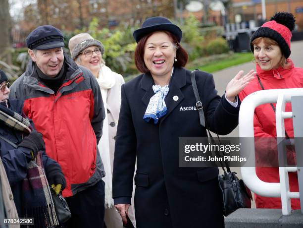 An Ascot Steward and racegoers during the PCF Racing Weekend and Shopping Fair at Ascot Racecourse on November 24, 2017 in Ascot, England.