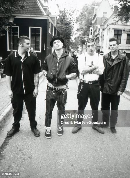 Group portrait of Rancid in Amsterdam, Netherlands, 1995. L-R Matt Freeman, Tim Armstrong, Lars Frederiksen, Brett Reed.