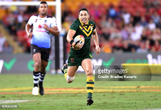 Billy Slater of Australia breaks away from the defence during the 2017 Rugby League World Cup Semi Final match between the Australian Kangaroos and...
