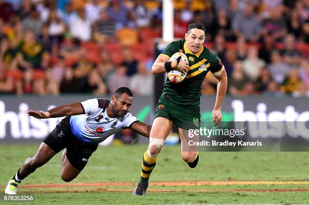 Billy Slater of Australia breaks away from the defence during the 2017 Rugby League World Cup Semi Final match between the Australian Kangaroos and...