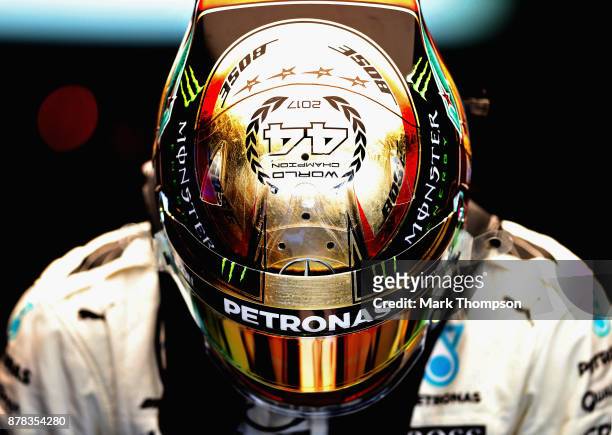 Lewis Hamilton of Great Britain and Mercedes GP prepares to drive in the garage during practice for the Abu Dhabi Formula One Grand Prix at Yas...
