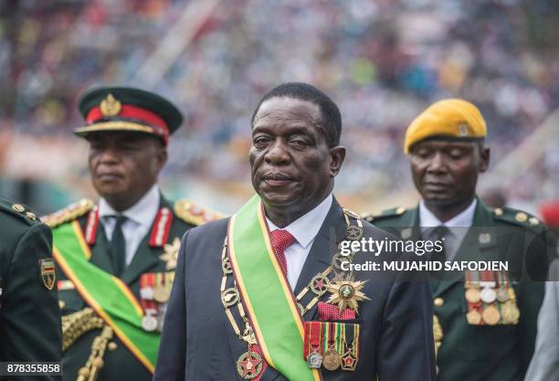 New interim Zimbabwean President Emmerson Mnangagwa looks on after he was officially sworn-in during a ceremony in Harare on November 24, 2017....