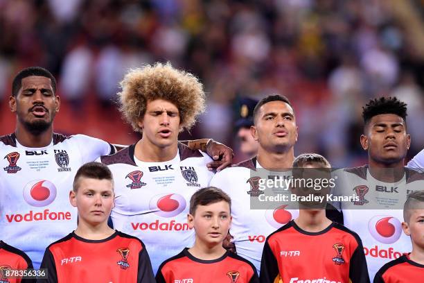 Fijian players embrace for their national anthem before the 2017 Rugby League World Cup Semi Final match between the Australian Kangaroos and Fiji at...