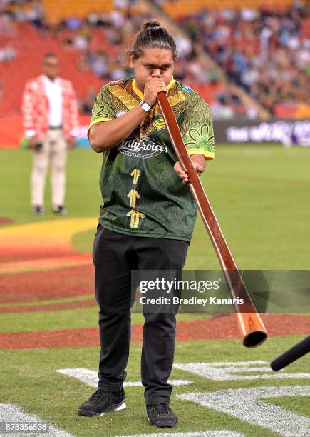 An indigenous man plays the didgeridoo before the 2017 Rugby League World Cup Semi Final match between the Australian Kangaroos and Fiji at Suncorp...