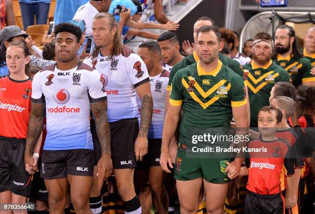 Kevin Naiqama of Fiji and Cameron Smith of Australia lead their teams out before the 2017 Rugby League World Cup Semi Final match between the...