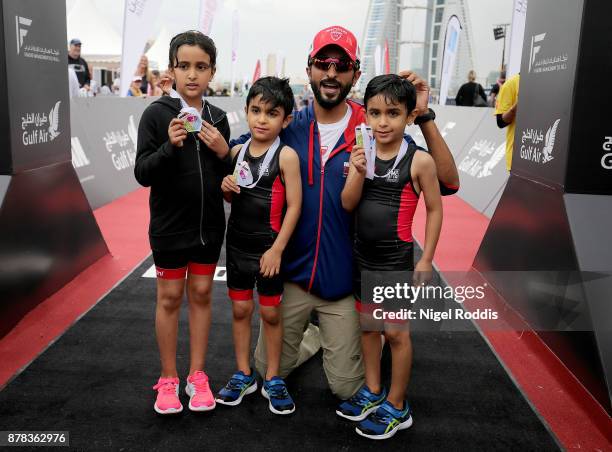 Sheikh Nasser Bin Hamad Al Khalifa poses for the media with his children after the Iron Kids race of IRONMAN 70.3 Middle East Championship Bahrain on...