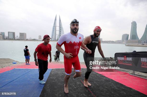 Athletes exit the water after practice for IRONMAN 70.3 Middle East Championship Bahrain on November 24, 2017 in Bahrain, Bahrain.