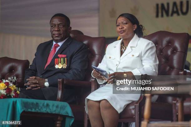 Zimbabwean newly sworn-in President Emmerson Mnangagwa and his wife Auxilia sit during the Inauguration ceremony at the National Sport Stadium in...