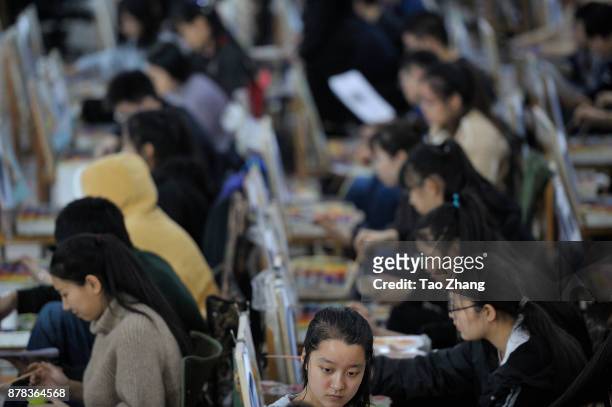 Senior high school students painting to major in art prepare for the upcoming college entrance exam at a training institute in Harbin, China's...