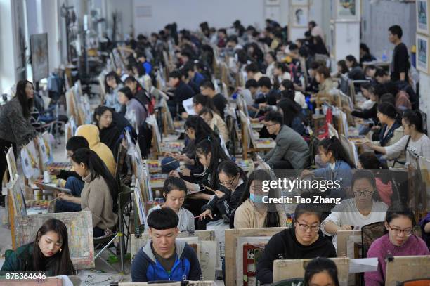 Senior high school students painting to major in art prepare for the upcoming college entrance exam at a training institute in Harbin, China's...