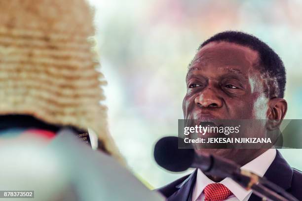 New interim Zimbabwean President Emmerson Mnangagwa is officially sworn-in by Chief judge of the Supreme Court, Chief Justice Luke Malaba during a...