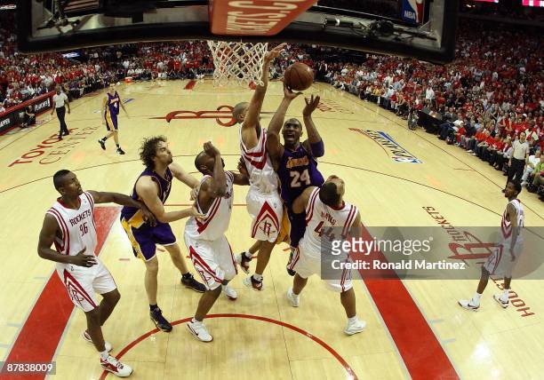Guard Kobe Bryant of the Los Angeles Lakers takes a shot against Shane Battier of the Houston Rockets in Game Six of the Western Conference...