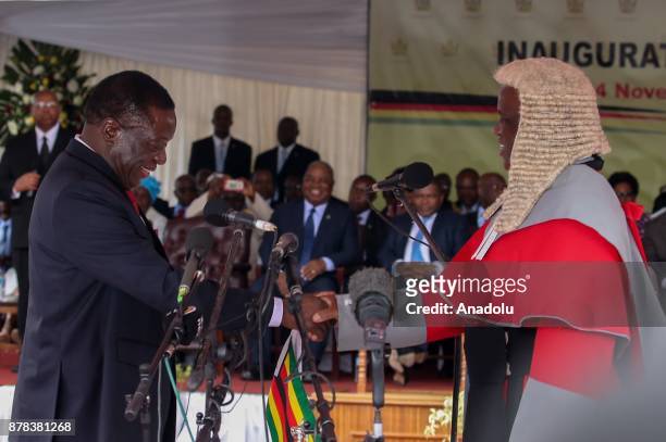 New Zimbabwe President Emerson Mnangagwa swears in during an oath-taking ceremony at the National Sports Stadium in Harare, Zimbabwe on November 24,...