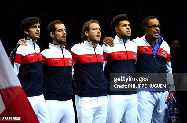 French players Pierre-Hugues Herbert, Richard Gasquet, Lucas Pouille, Jo-Wilfried Tsonga and France's captain Yannick Noah, sing the national anthem...