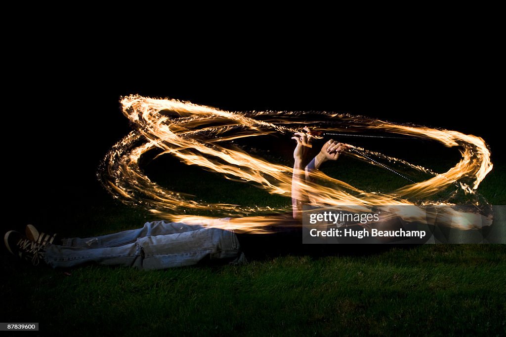 Fire Poi Spinner - Lying down