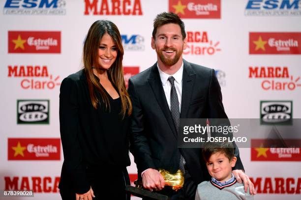 Barcelona's Argentinian forward Lionel Messi poses his wife Antonella Roccuzzo and their son Thiago after receiving the 2017 European Golden Shoe...