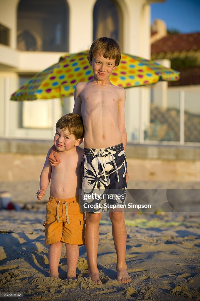 Portrait of brothers on the beach