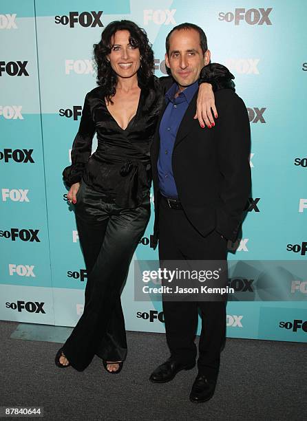 Actress Lisa Edelstein and actor Peter Jacobson attend the 2009 FOX UpFront after party at the Wollman Rink in Central Park on May 18, 2009 in New...