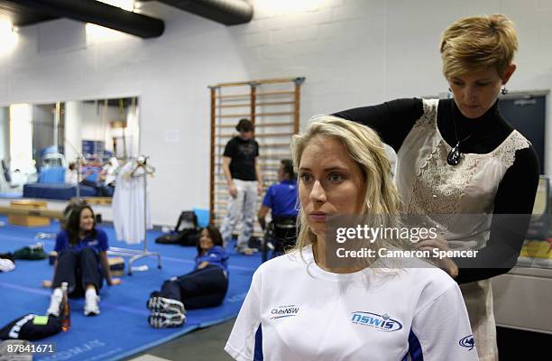 Olympic diver Alexandra Croak has her hair done backstage prior to showcasing the NSW Institute of Sport uniform fashion parade on May 19, 2009 in...