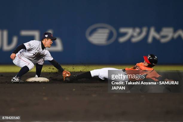 Ryusei Hara of Matsuyama City IX is tagged out by Ichita Nagumo of Japan at second base in the sixth inning during the U-15 Asia Challenge Match...
