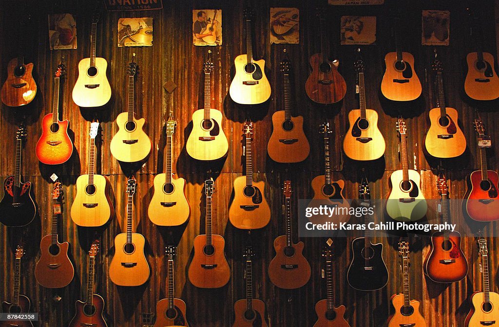 Acoustic guitars on a wall