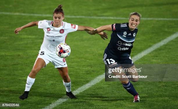 Laura Spiranovic of the Victory and Kahlia Hogg of the Wanderers compete for the ball during the round eight W-League match between the Melbourne...