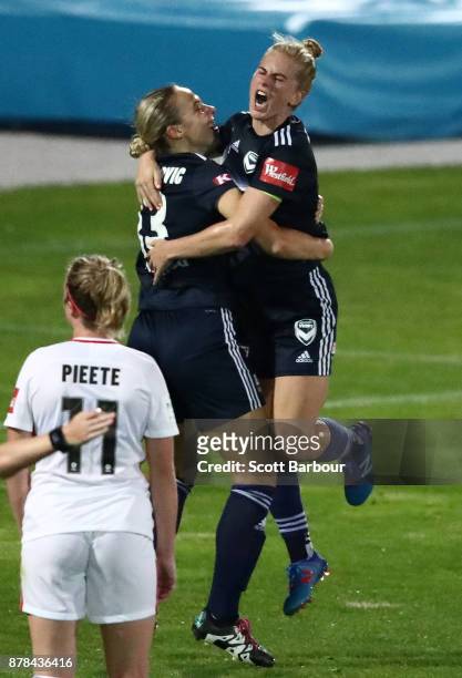 Natasha Dowie and Laura Spiranovic of the Victory celebrate after scoring their first goal of the match during the round eight W-League match between...