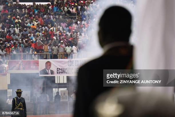 Smoke rises from cannon as the military regiment makes a 21-gun salute during the inauguration of Zimbabwes new President Emmerson Mnangagwa on...