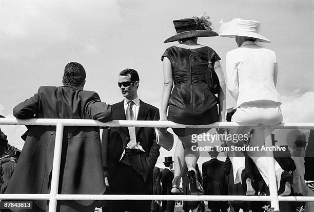 Fashionable punters watch the horses parade before a race at Epsom, June 2007. Epson Downs Racecourse is where the iconic Derby Festival dating back...