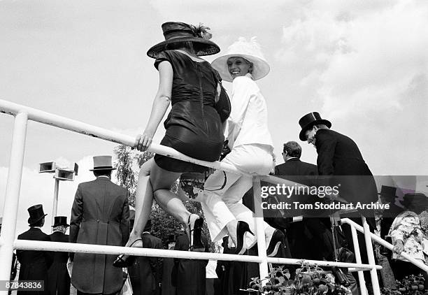 Fashionable punters watch the horses parade before a race at Epsom, June 2007. Epson Downs Racecourse is where the iconic Derby Festival dating back...