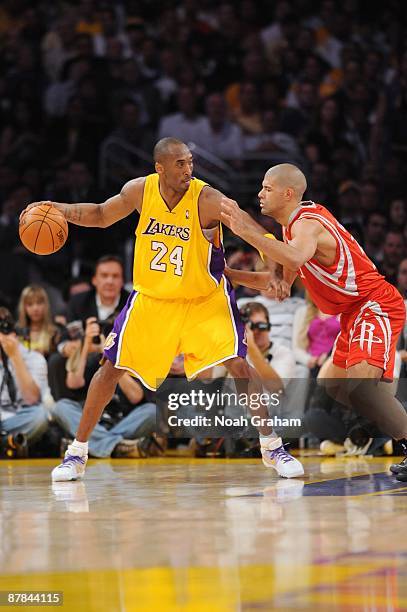 Kobe Bryant of the Los Angeles Lakers looks to make a move against Shane Battier of the Houston Rockets in Game Five of the Western Conference...