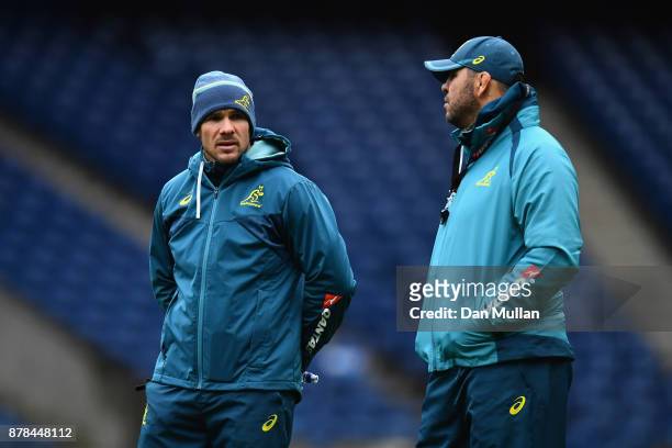Nathan Grey, Defence Coach of Australia speaks with Michael Cheika, Head Coach of Australia during the Australia Captain's Run at Murrayfield Stadium...